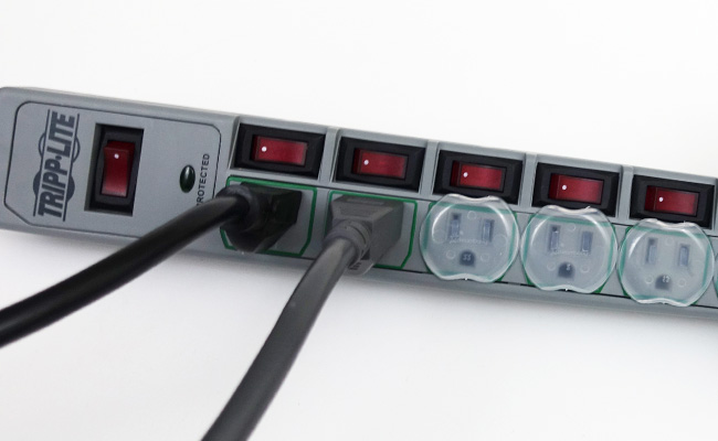 Aquarium power strip with child safety plugs in unused sockets to prevent water from entering sockets