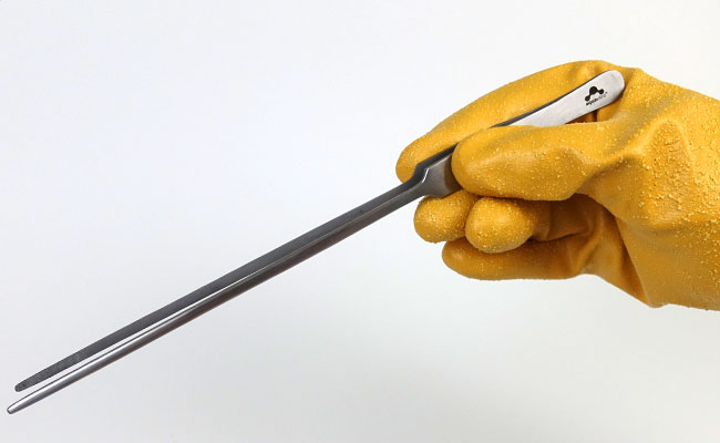 Holding long aquascaping tweezers with hand protected by Showa 772 aquarium glove