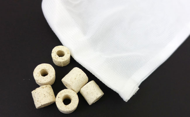 Filter media bag with ceramic rings