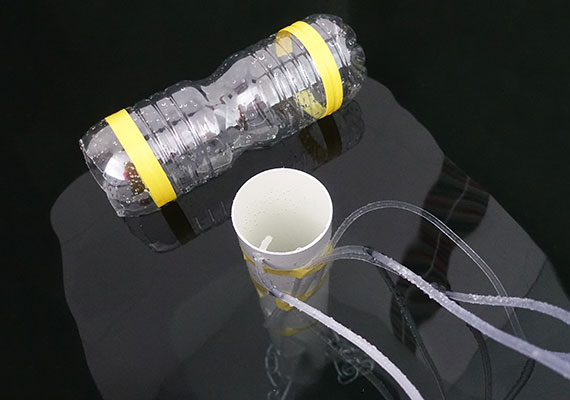 Testing aquarium air pump performance in water drum