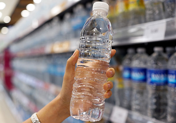 Bottled drinking water on shelf of grocery store