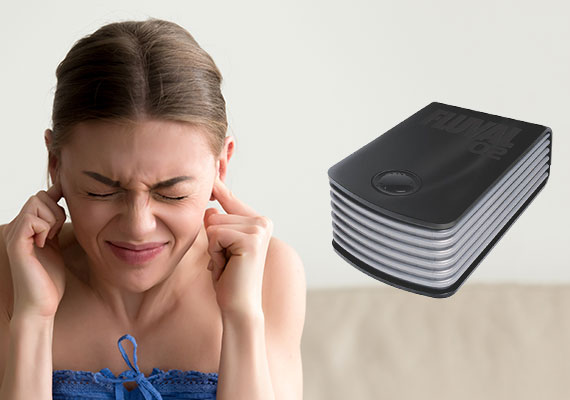 Woman with fingers in her ears trying to block sound from loud air pump