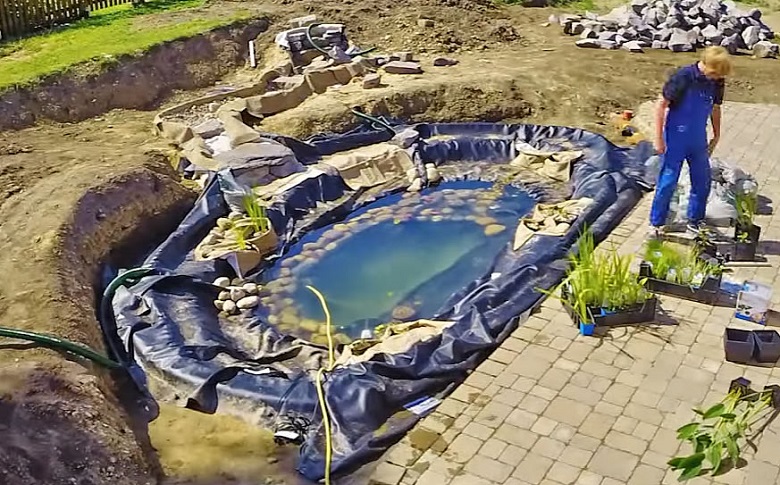 finishing touches while building a koi pond